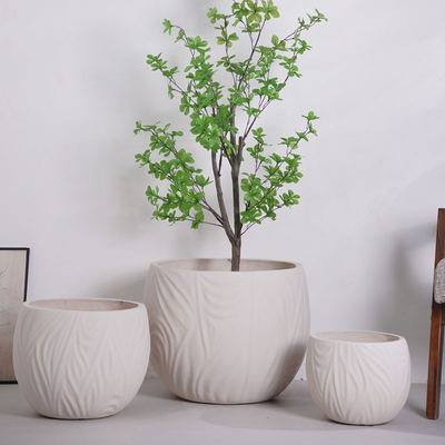 kupować neutral beige round fiber clay planter with irregular wavy lines pattern lightweight durable low-maintainence flower pot holiday Villa hotel shopping mall office decoration garden landscaping project online manufacture